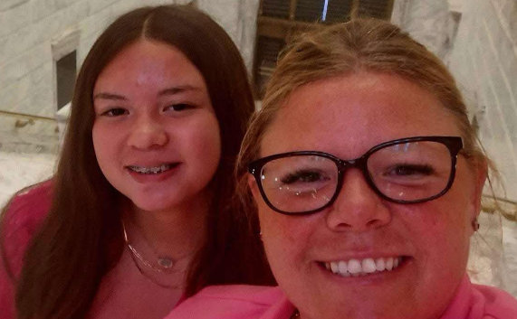 Roberta Lewis with family outdoors